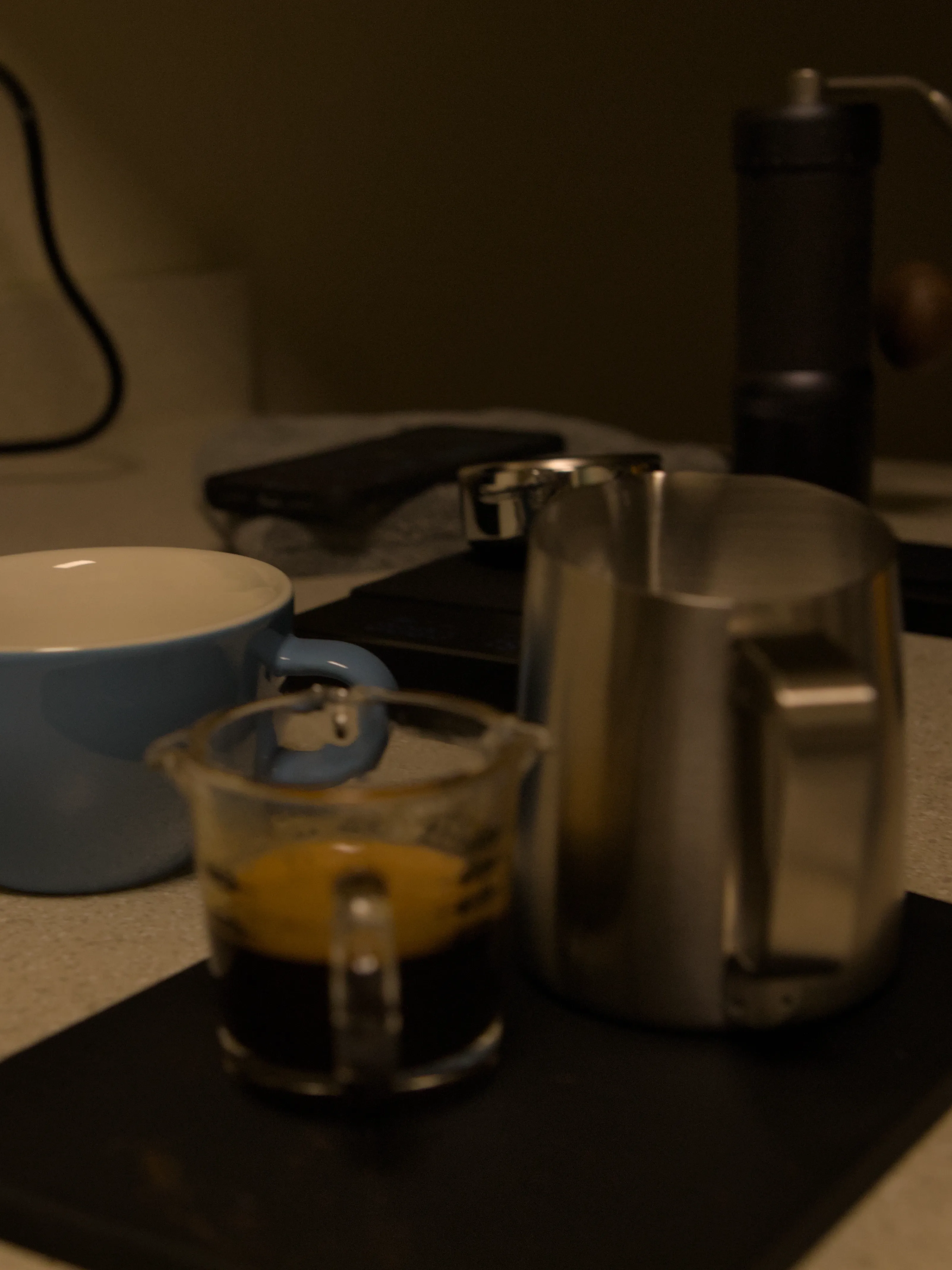 Coffee cup, espresso shot, and milk jug